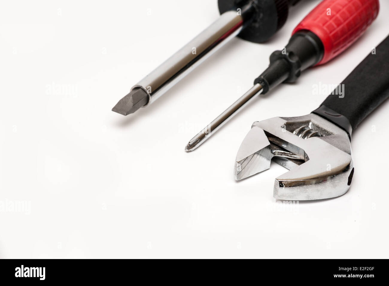 Monkey wrench and screwdriver Stock Photo