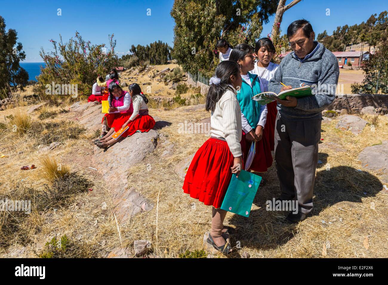 Peru, Puno Province, Lake Titicaca, Taquile Island, schoolchildren have outdoor classroom Stock Photo