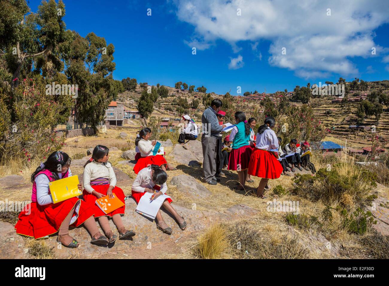Peru, Puno Province, Lake Titicaca, Taquile Island, schoolchildren have outdoor classroom Stock Photo