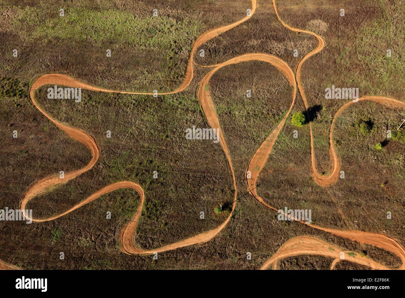 Italy, Tuscany, Val d'Elsa, Monteriggioni, fields, motocross track (aerial view) Stock Photo