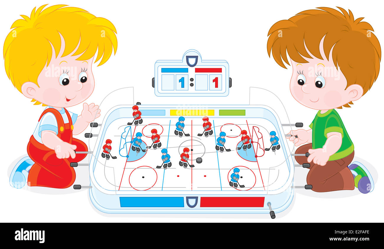 Boys play table hockey Stock Photo Alamy