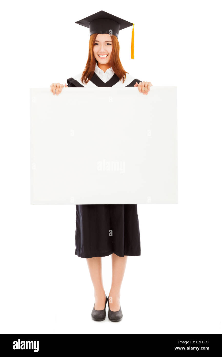 happy young female graduation students with blank board Stock Photo