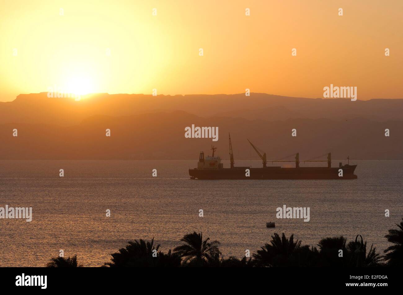 Jordan, Aqaba Governorate, Aqaba, Bay of Aqaba, sunset over a ship Stock Photo
