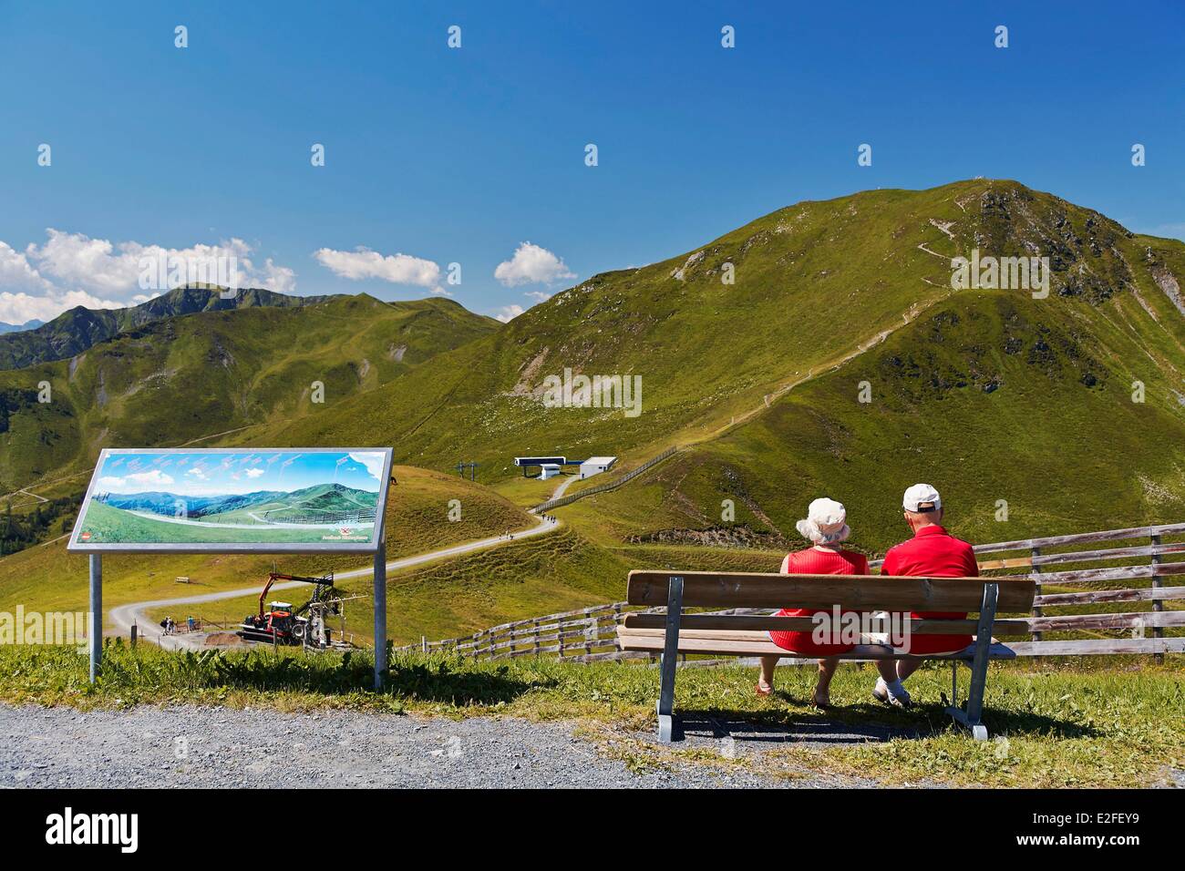 Austria Land of Salzburg Kitzbuhel Alps Saalbach Hinterglemm Saalbach Hinterglemm valley Man and Woman looking towards the Stock Photo