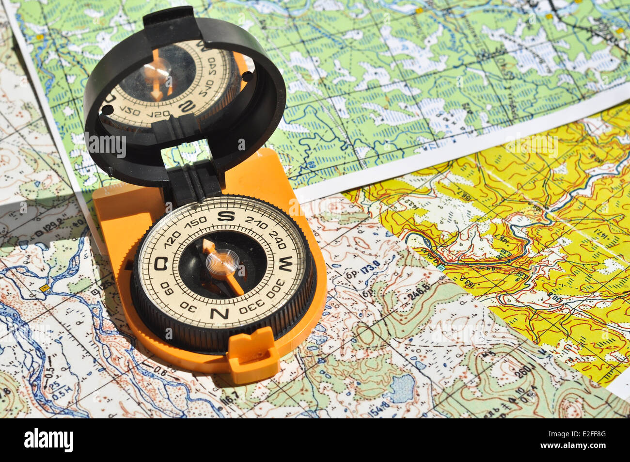 Maps and compass. Compass on the map this is the open door to the