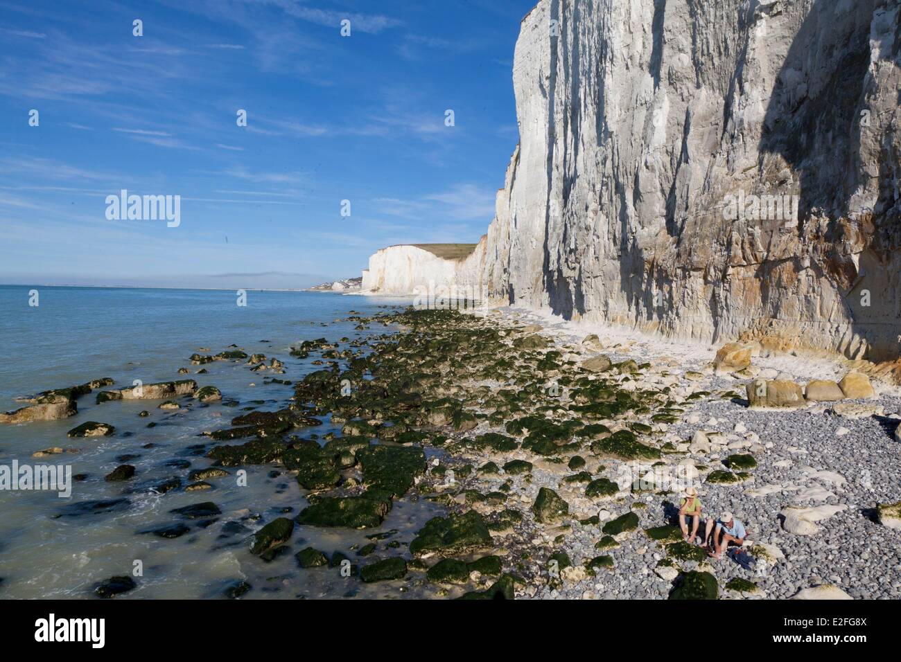 France, Somme, Ault, pebble beach at high tide at the foot of cliffs Stock Photo