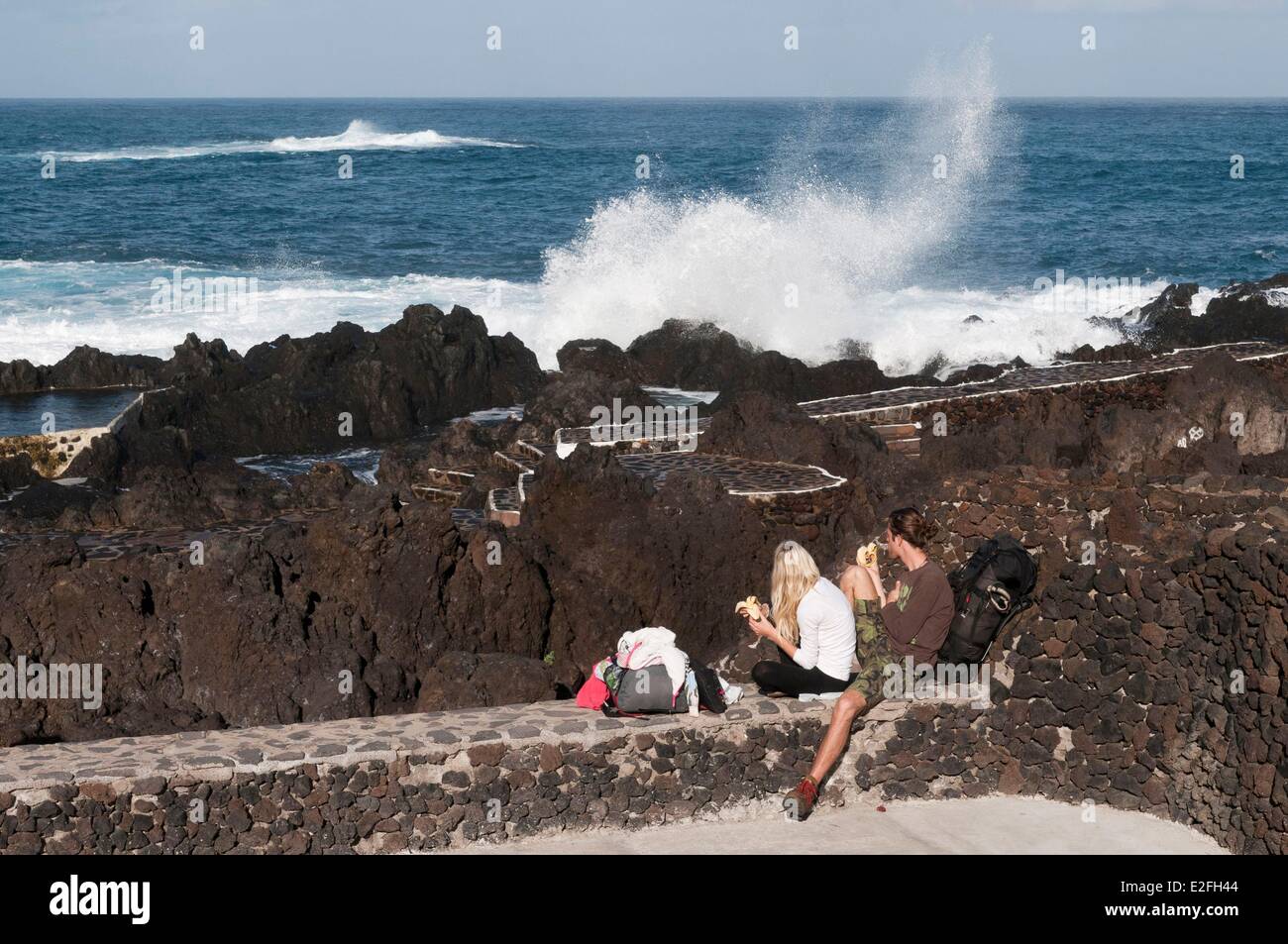 Spain, Canary Islands, Tenerife Island, Garachico, couple facing the sea Stock Photo