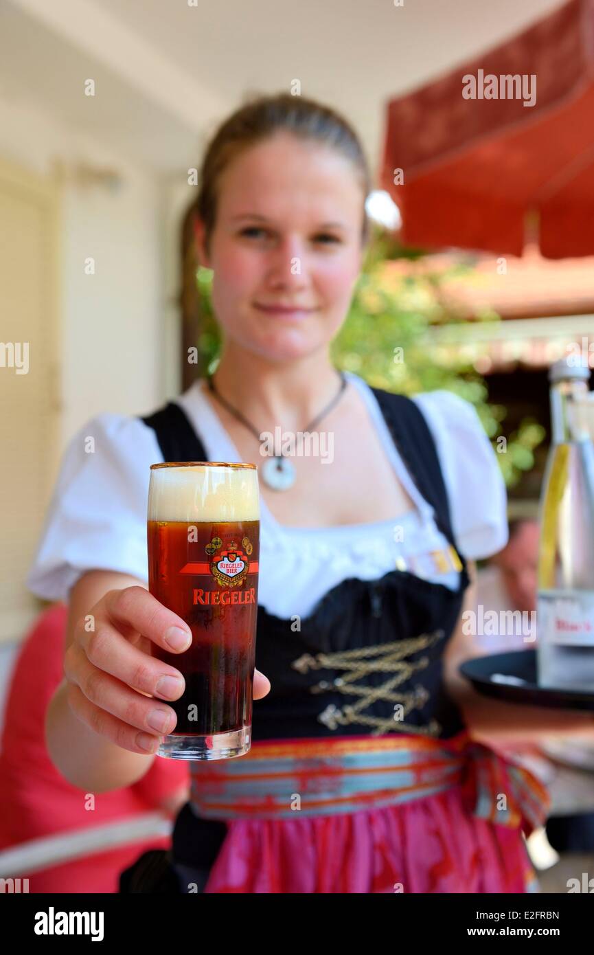 Germany Baden Wurttemberg Durbach Rebstock Hotel and restaurant waitress in traditional costume Riegeler bier Stock Photo