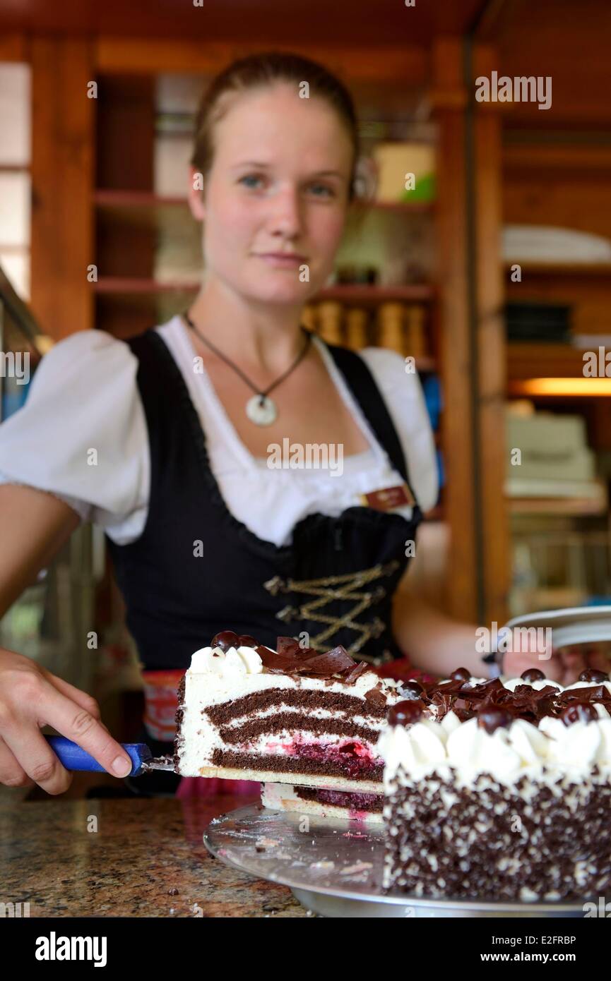 Germany Baden Wurttemberg Durbach Rebstock Hotel and restaurant waitress in traditional costume Black Forest cake Stock Photo