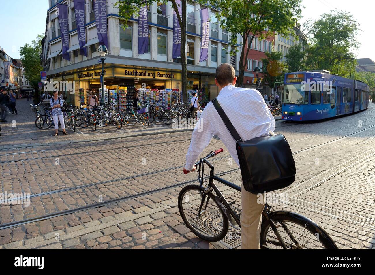 Germany Baden Wurttemberg Freiburg im Breisgau tram and cyclist in Bertoldstrasse Stock Photo