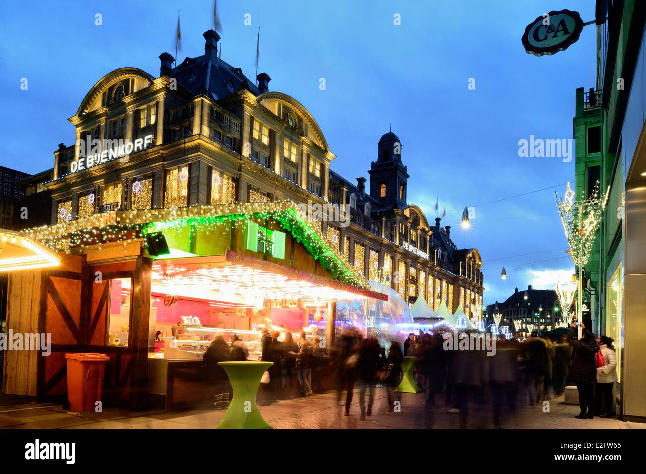 Netherlands Amsterdam Damrak avenue Christmas markets and Bijenkorf Stock Photo Alamy