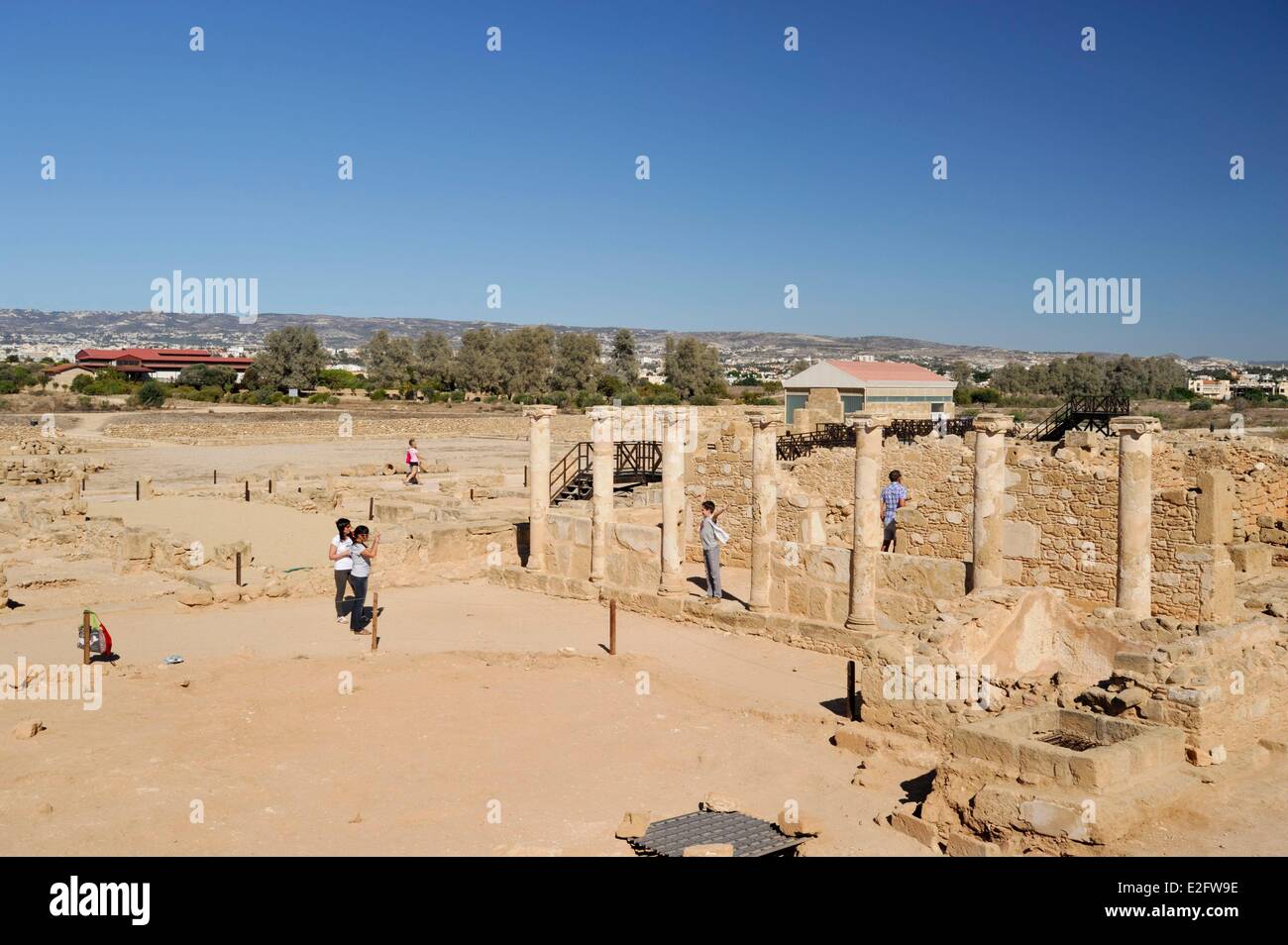 Cyprus Paphos District Paphos archaeological site of Paphos visitors taking pictures of columns Stock Photo