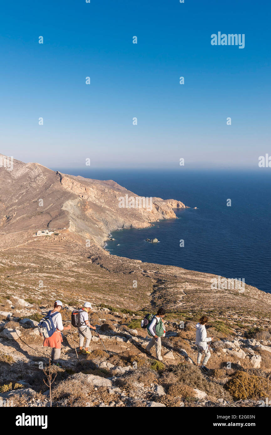 Greece Cyclades Islands Anafi Island hiking to the old Kalamiotissa Monastery perched on the tall monolithic rock of Kalamos Stock Photo