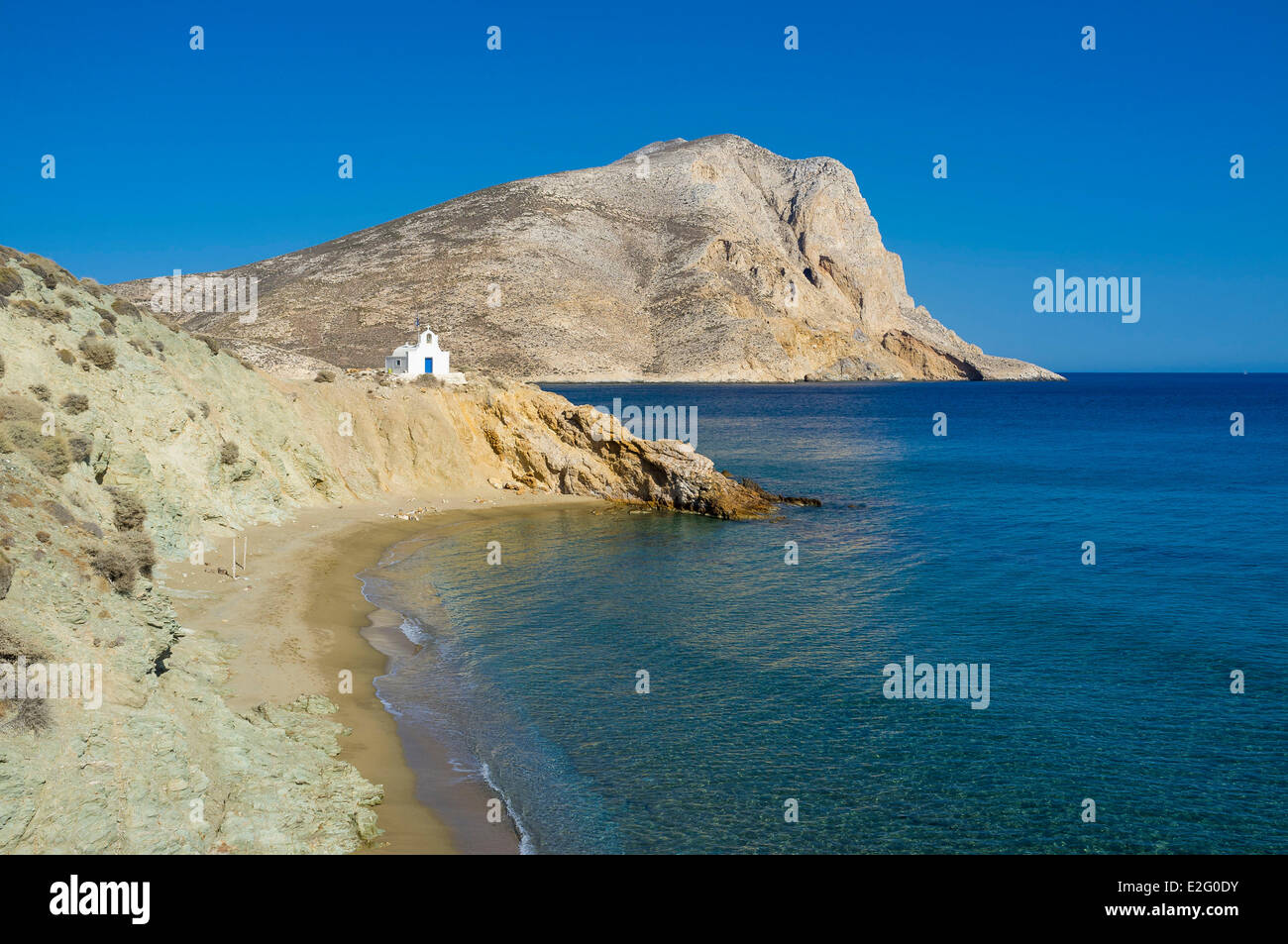 Greece Cyclades Islands Anafi Island beach and church Agii Anargyri Kalamos rock in the background Stock Photo