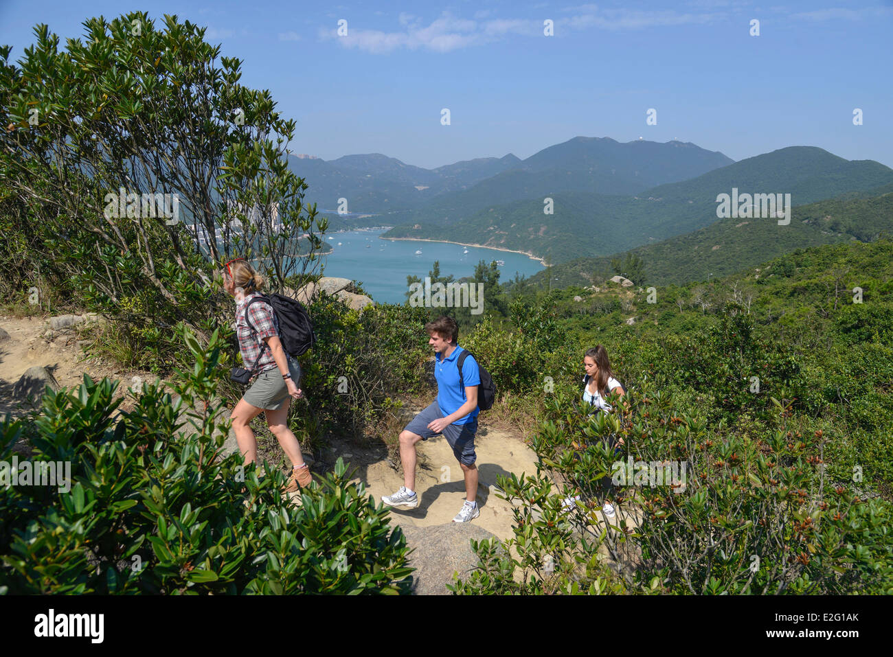 China Hong Kong Hong Kong Island Bay of Tai Tam walkers on the hiking
