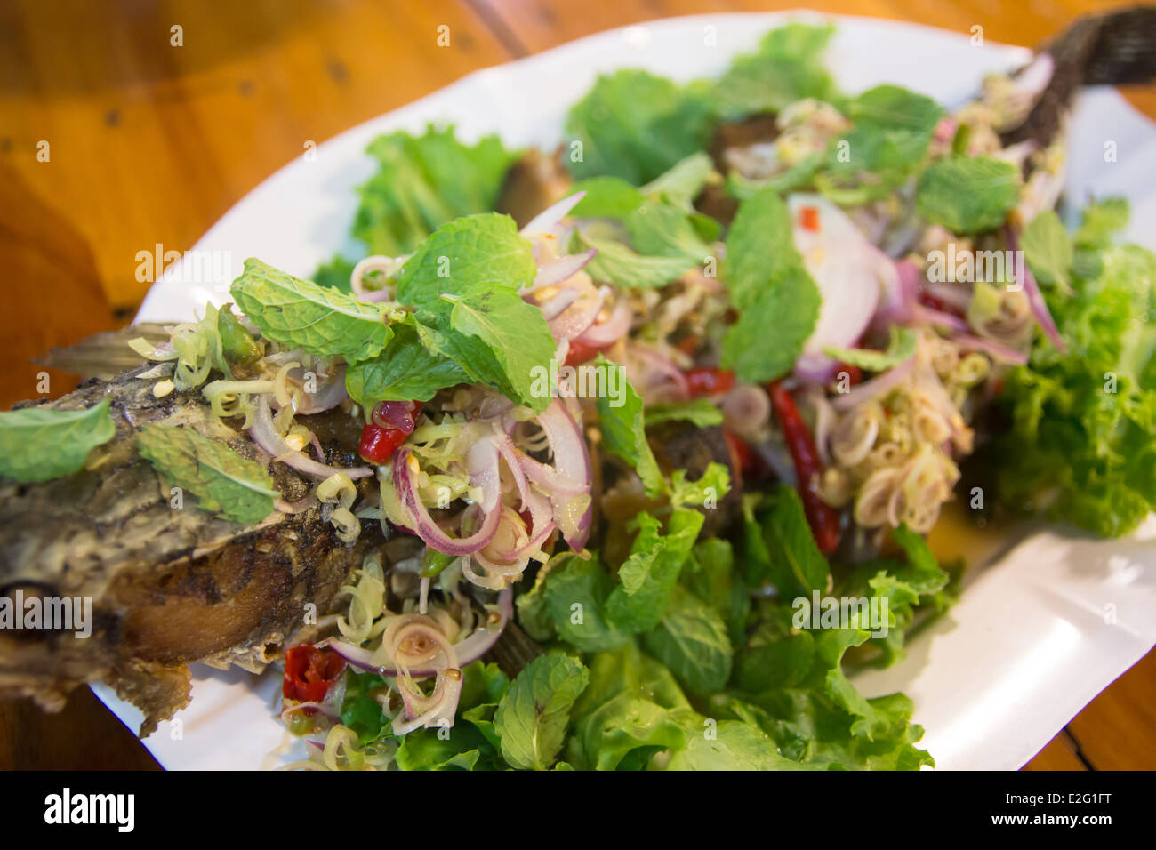 Spicy Snake head Fish fried salad Stock Photo
