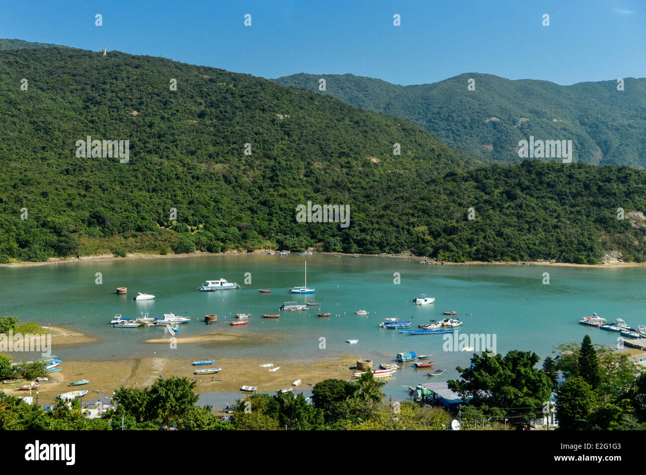 China Hong Kong Hong Kong Island Bay of Tai Tam small fishing port in a handle with the mountains of the Dragon's Baack in the Stock Photo