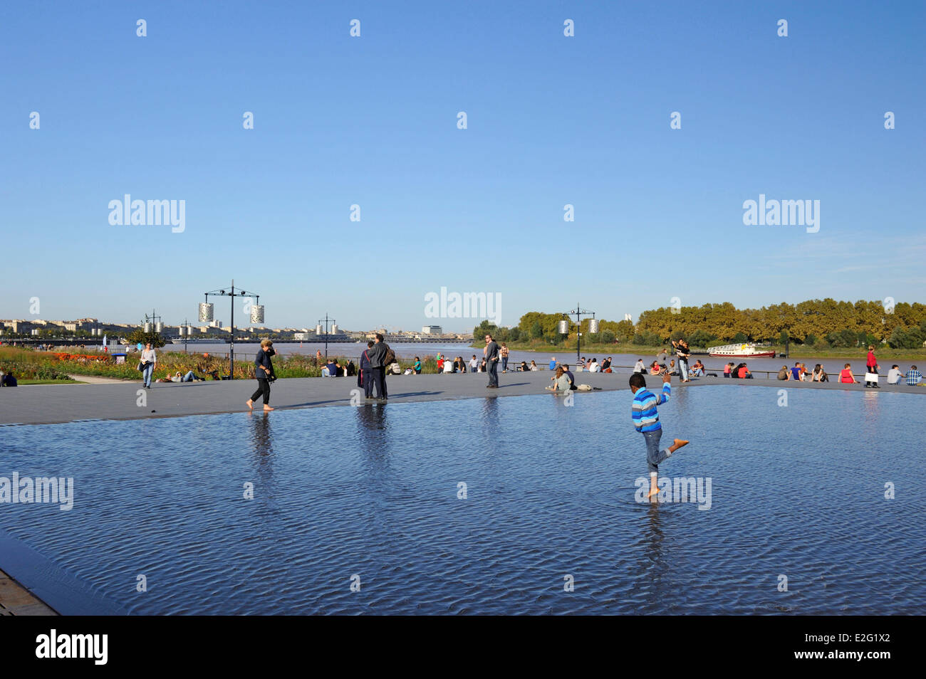 France Gironde Bordeaux Bourse square Water Mirror work of Michel Corajoud child walking on the water Stock Photo
