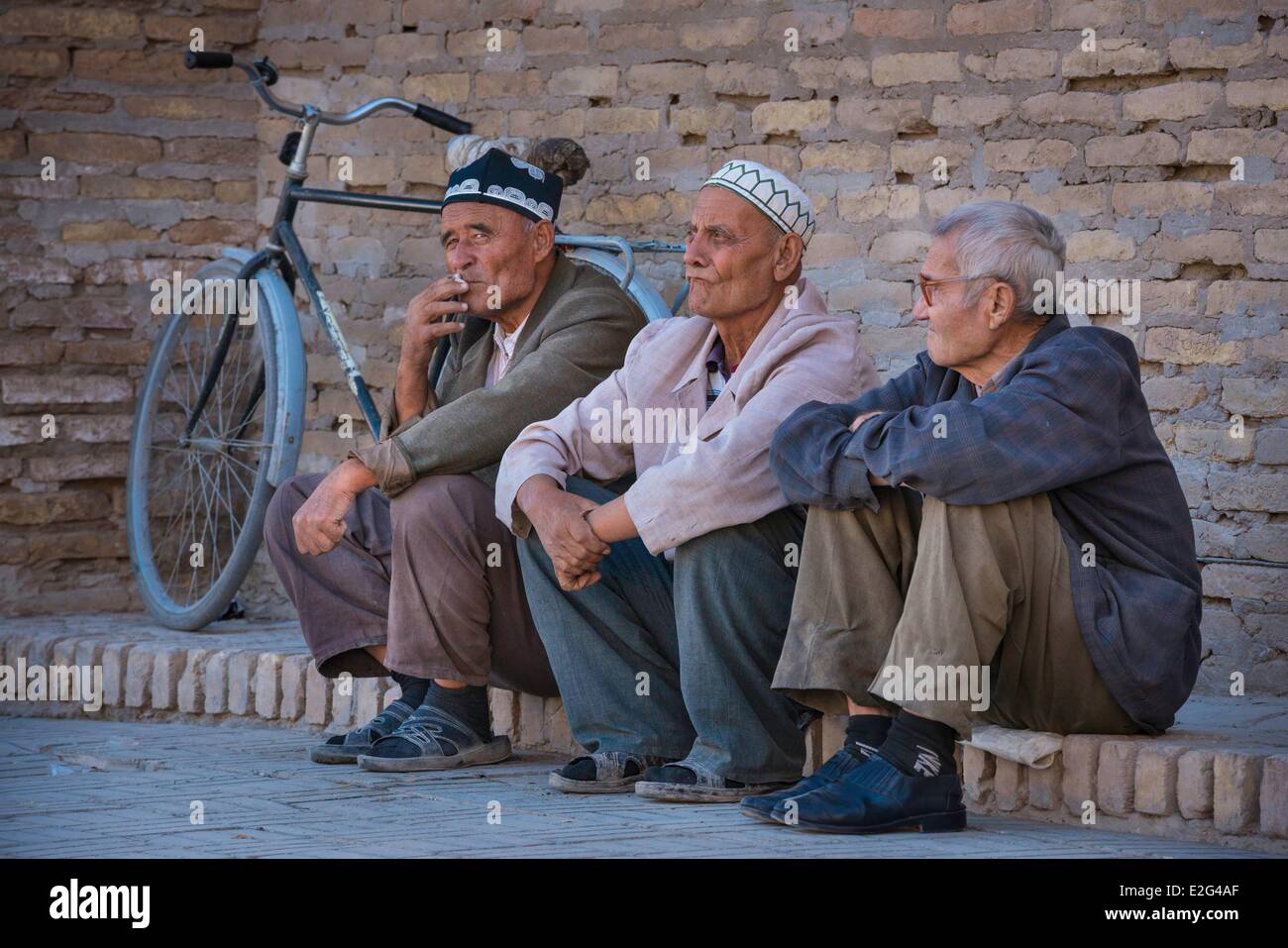 Uzbekistan Silk Road Khorezm province Khiva Itchan Kala protected city listed as world heritage by UNESCO three uzbek men in Stock Photo