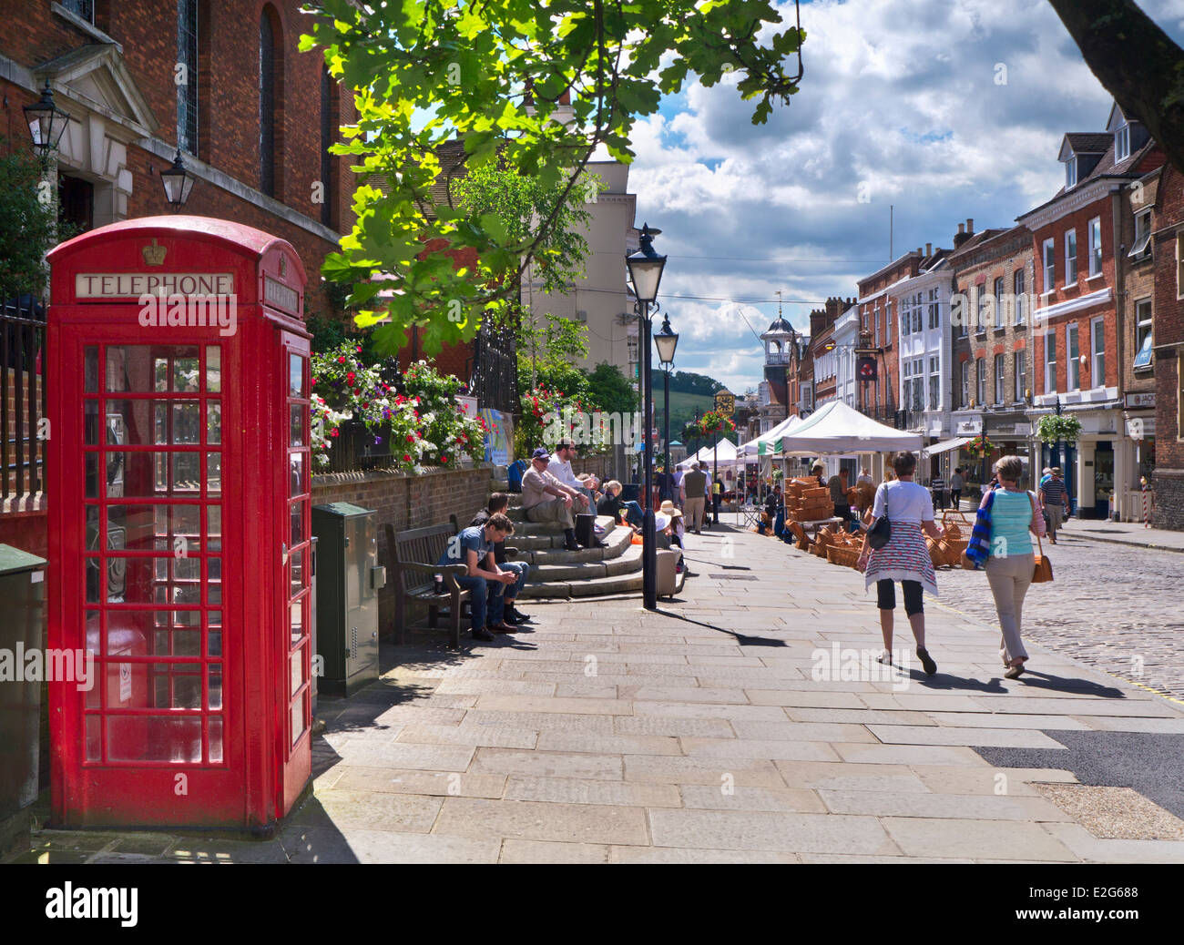 Guildford Market day High Street with shoppers on a summer arts and