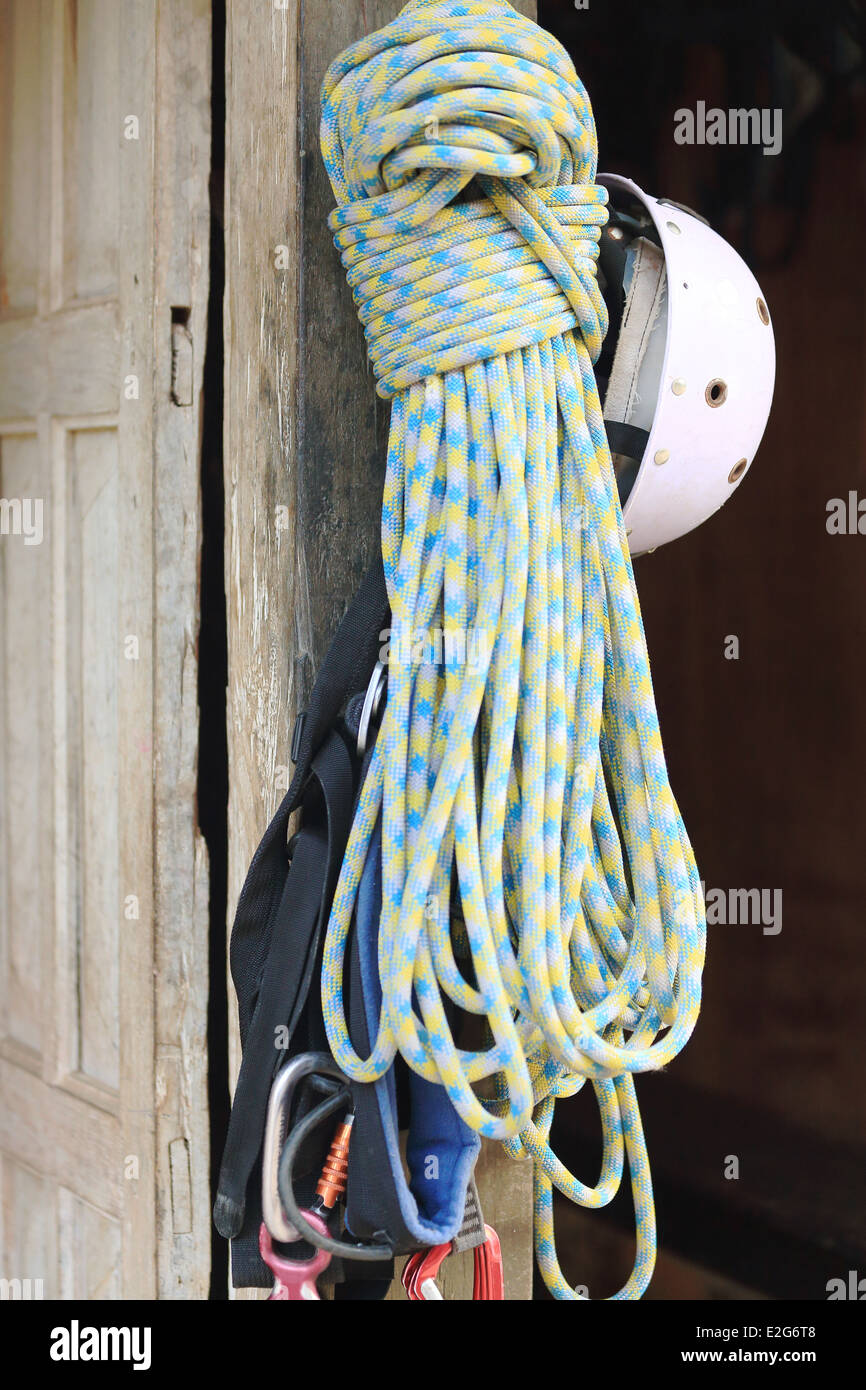 Technical climbing gear hanging at the door of a sports travel agency in BandipurNepal Stock