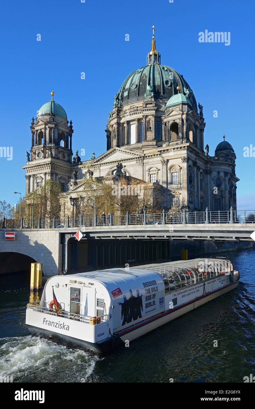 Germany Berlin Museum Island listed as World Heritage by UNESCO the Berliner Dom Protestant Cathedral and a tour boat on the Stock Photo