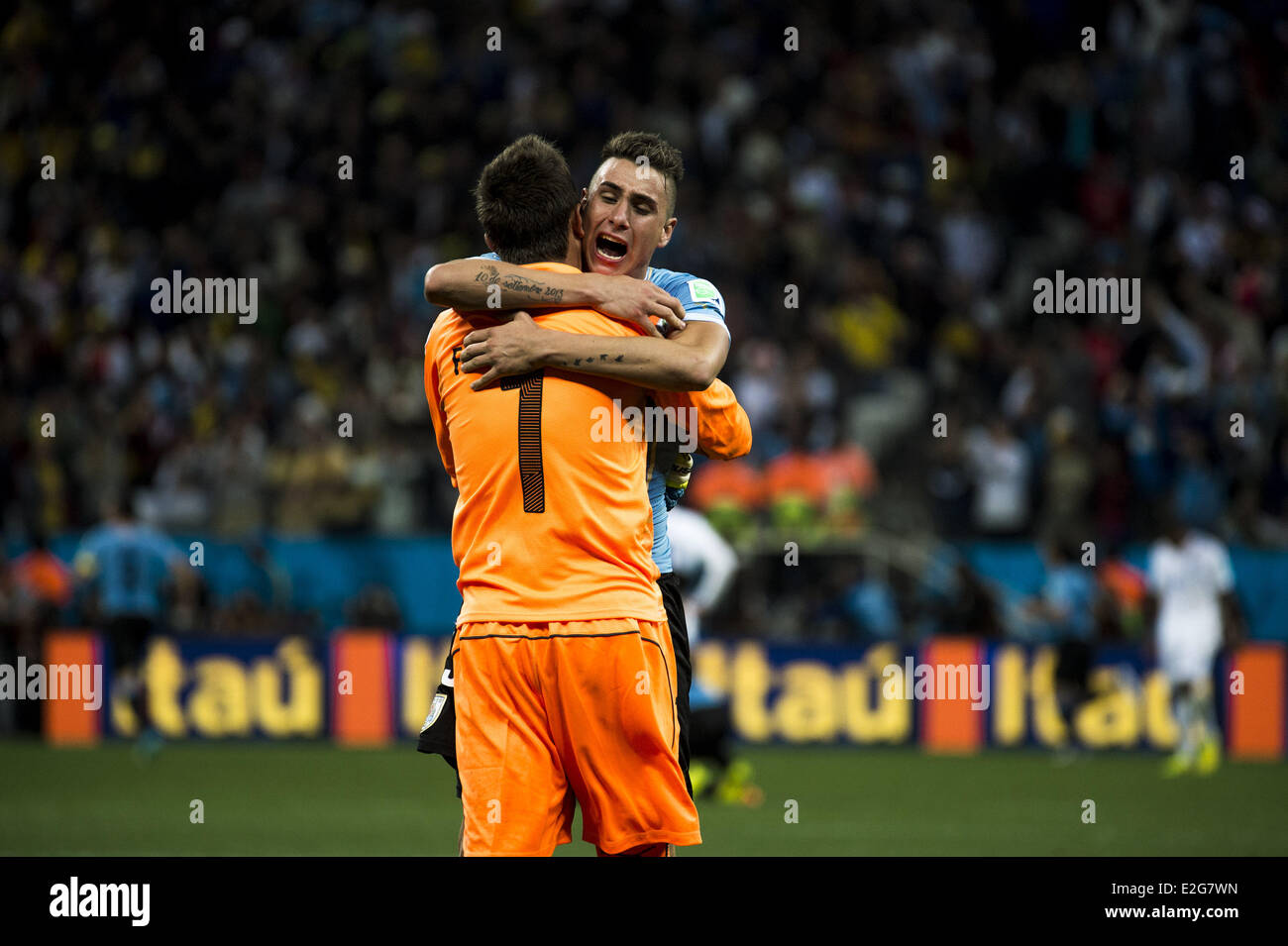 Sao Paolo, Brazil. 19th June, 2014. Fernando Muslera (1) e Jose Gimenez celebrate as Luis Suarez scores again, making it 2-1 for Uruguay at the match #23 of the 2014 World Cup, between England and Uruguay, this Thursday, June 19th, in Sao Paulo, Brasil Credit:  Gustavo Basso/NurPhoto/ZUMAPRESS.com/Alamy Live News Stock Photo