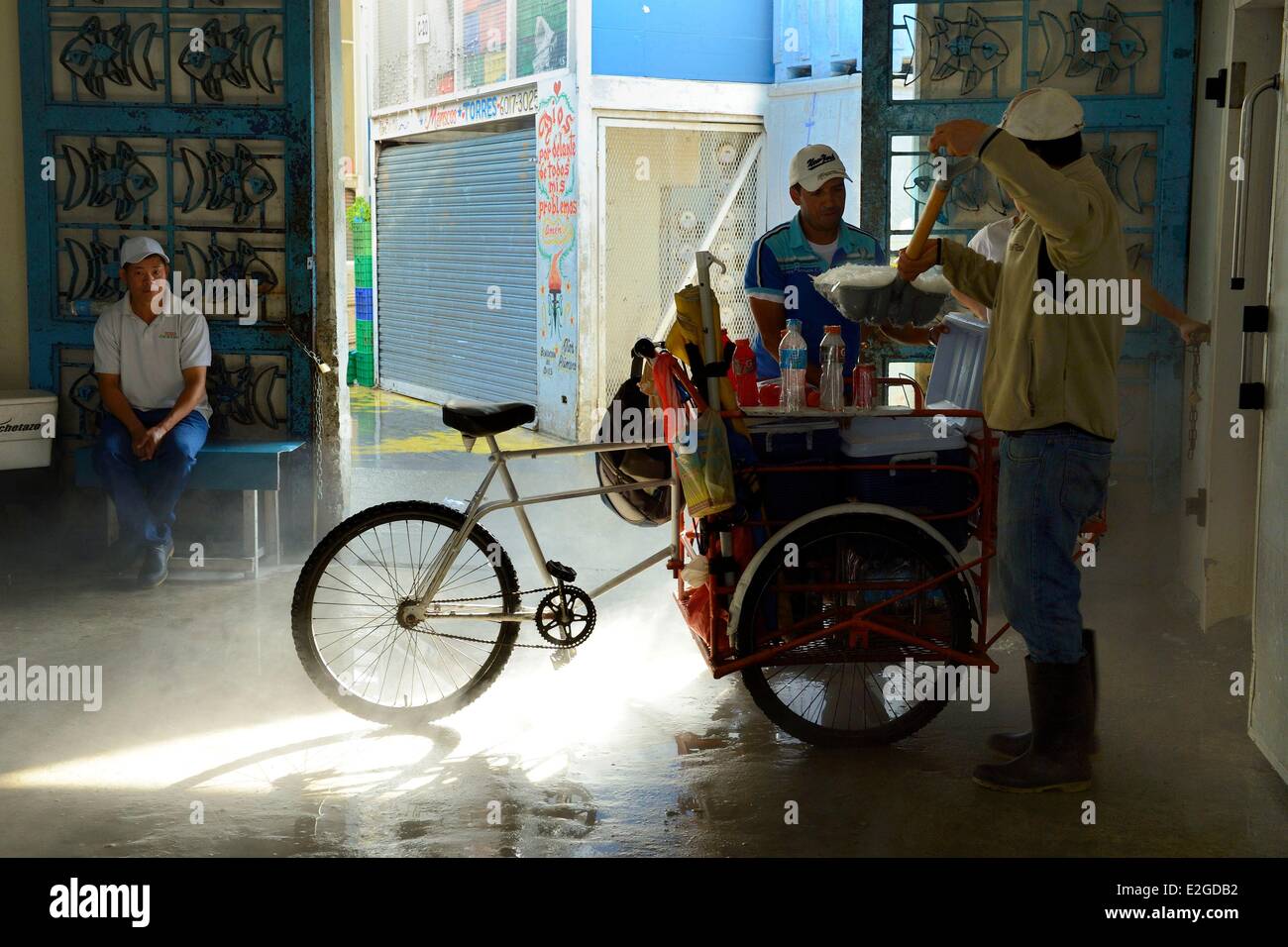Panama Panama City Santa Ana neighborhood Fish Market (Mercado de Mariscos) loading ice in a street vendor delivery tricycle Stock Photo