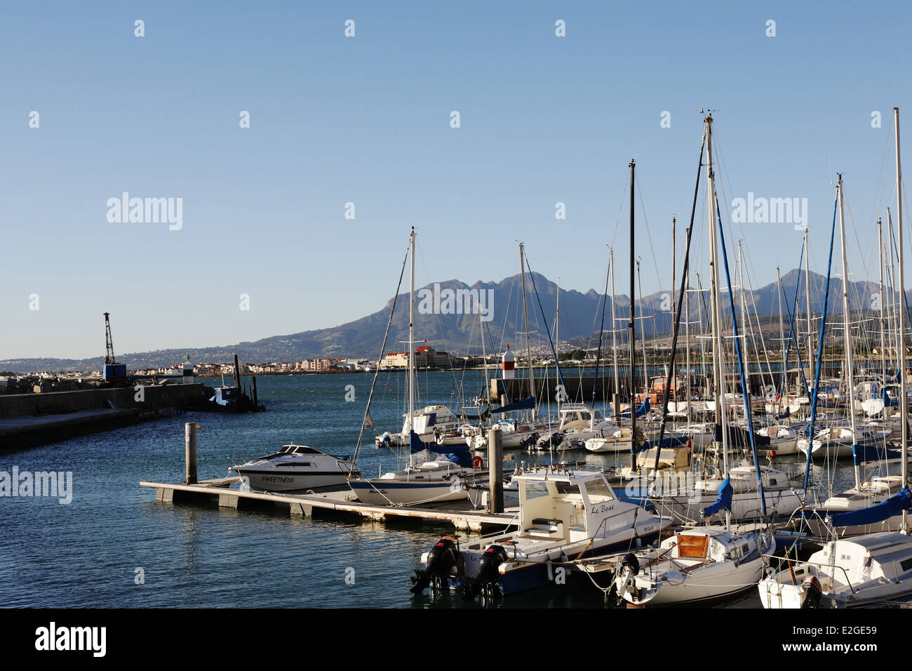 Leisure boats in the Gordons Bay Harbour on a sunny day Stock Photo