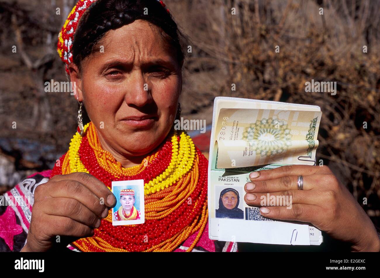 Pakistan Khyber Pakhtunkhwa Kalash valleys Kalash woman showing her passport obligation to being photographed veiled to get it and settle for a notified 'OTHER' at line religion in passports of Islamic Republic of Pakistan Stock Photo