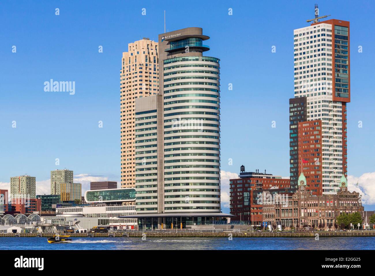 Netherlands South Holland Rotterdam overlooking Nieuwe Maas river and Southbank area with Hotel New York opened in 1993 in old building of Holland America Line and a water taxi Stock Photo