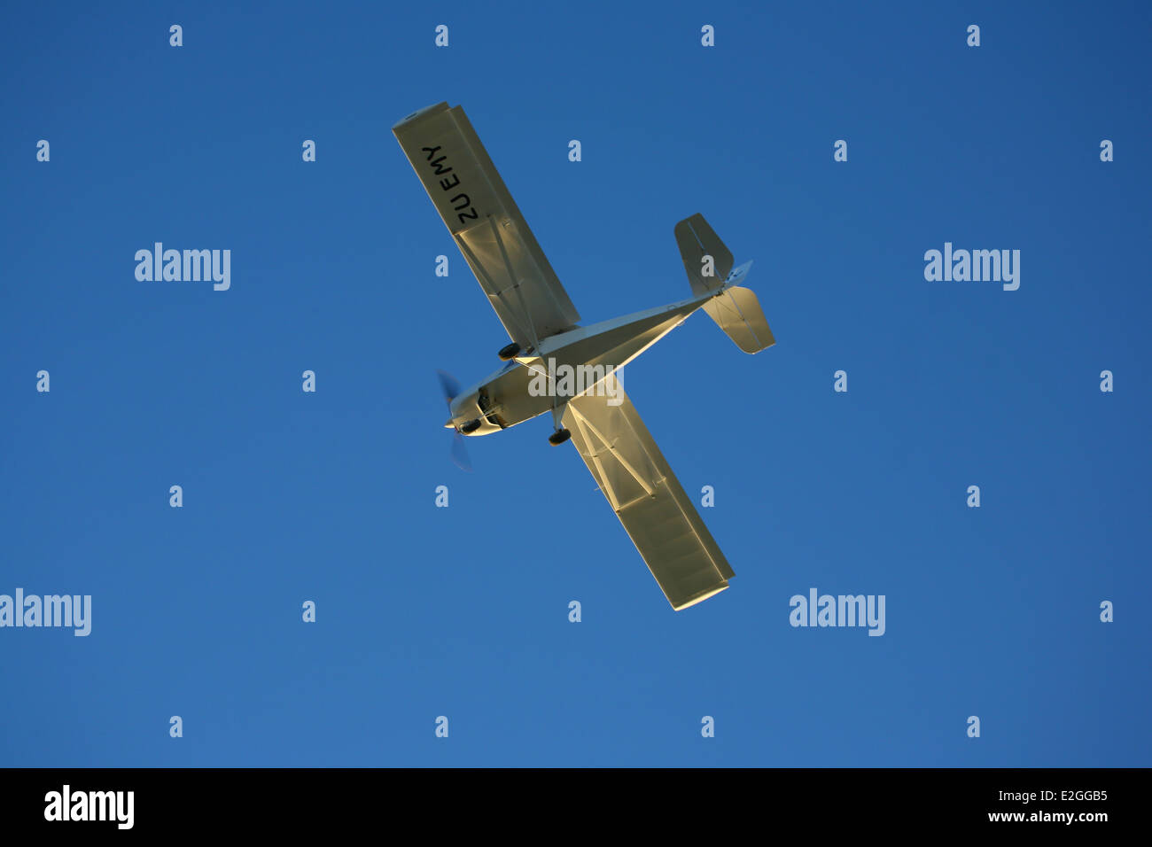 Microlight aeroplane isolated against a blue sky Stock Photo - Alamy