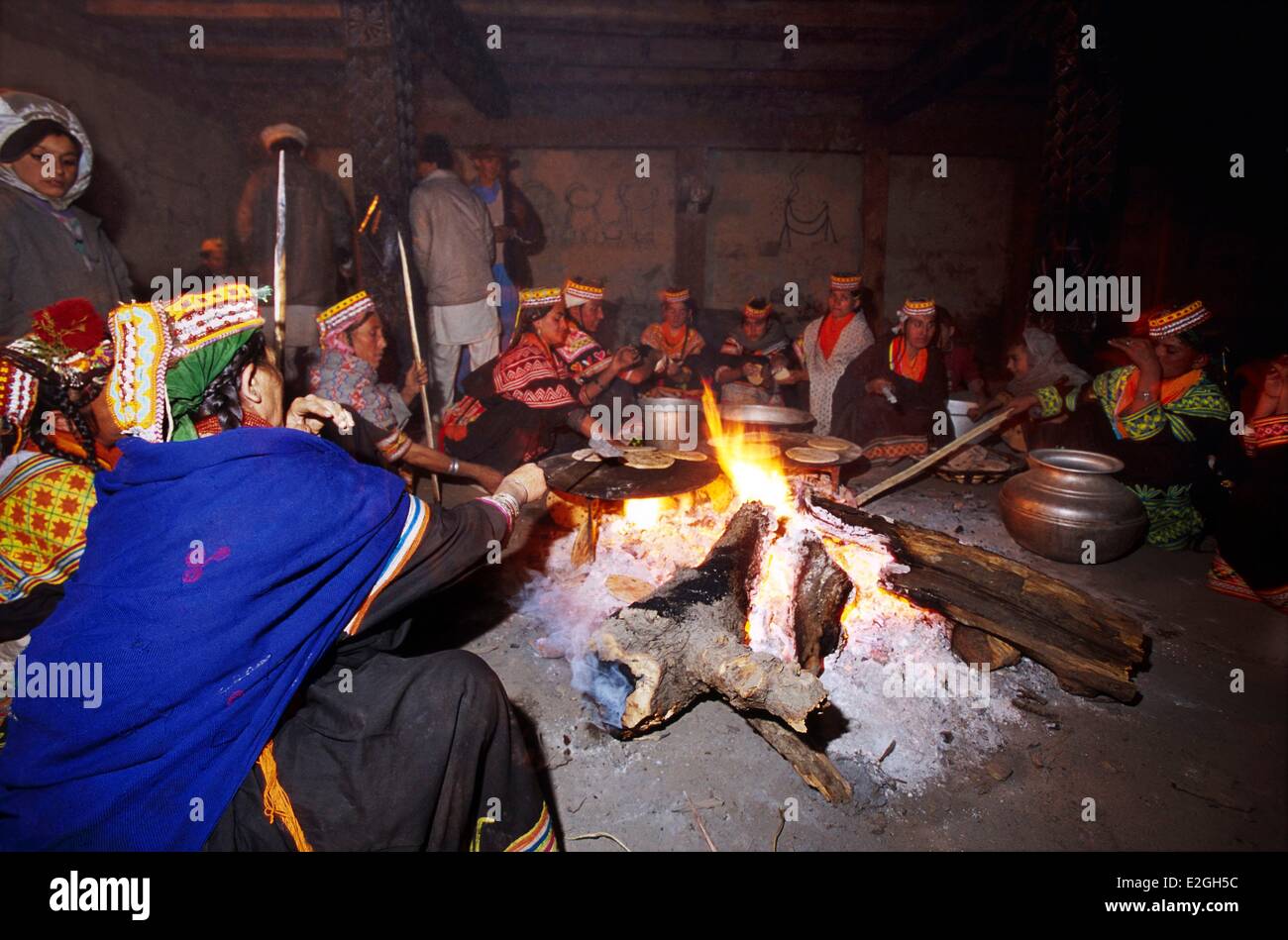 Pakistan Khyber Pakhtunkhwa Kalash valleys Bumburet valley Krakal village preparation of a group meal in Jestak Han house of lineages during celebrations of Chaumos winter solstice festival Stock Photo
