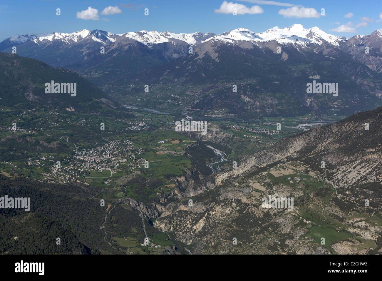 France Hautes Alpes View on Guillestre and Durance valley with snowy summits of mountains of Ecrins (aerial view) Stock Photo