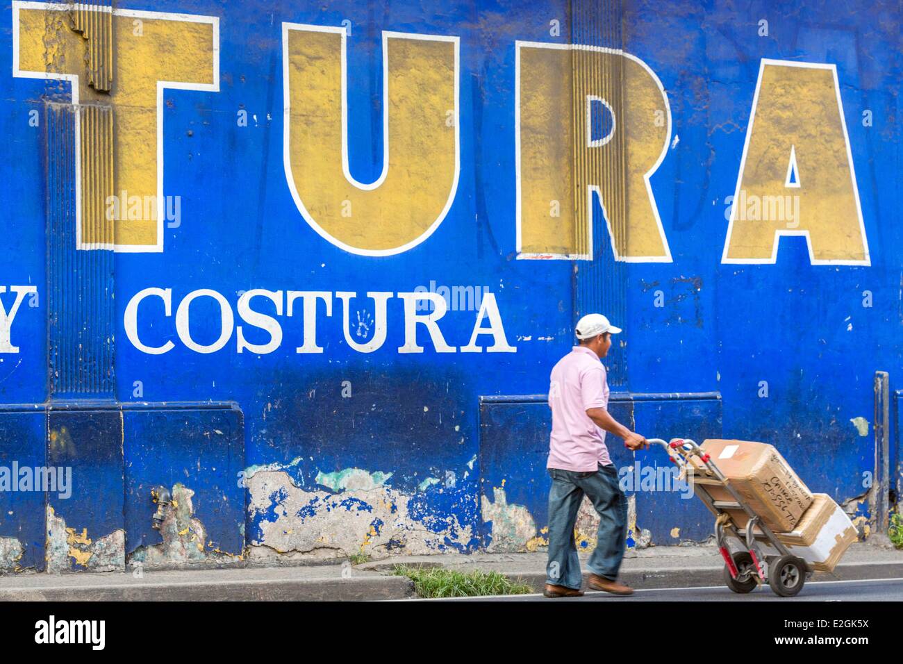 Panama Panama City district of Santa Ana deliverer front of a painted wall advertising Stock Photo