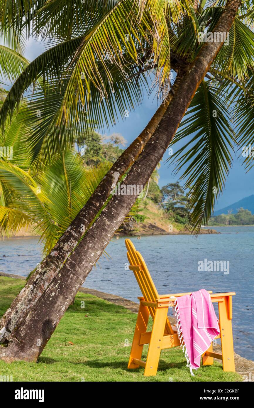 Panama Colon province Portobelo charming and El Otro Lado luxury chair beside bay Stock Photo