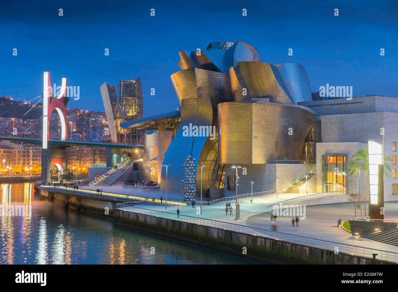 Spain Basque Country Region Vizcaya Province Bilbao Guggenheim Museum by architect Frank Gehry and Salve bridge with Les Arches Rouges artpiece by French artist Daniel Buren Stock Photo