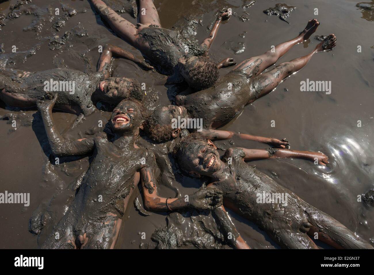 Papua New Guinea New Britain island West New Britain province Cap Gloucester district Kimbe area Akonga village kid playing in mud Stock Photo
