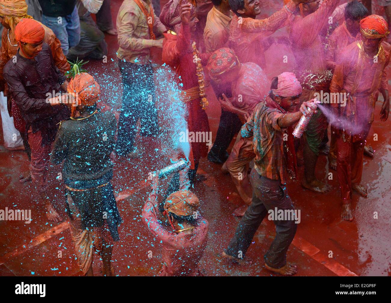 India Uttar Pradesh State in Barsana temple people receive coloured powder during Holi festival celebrations Stock Photo