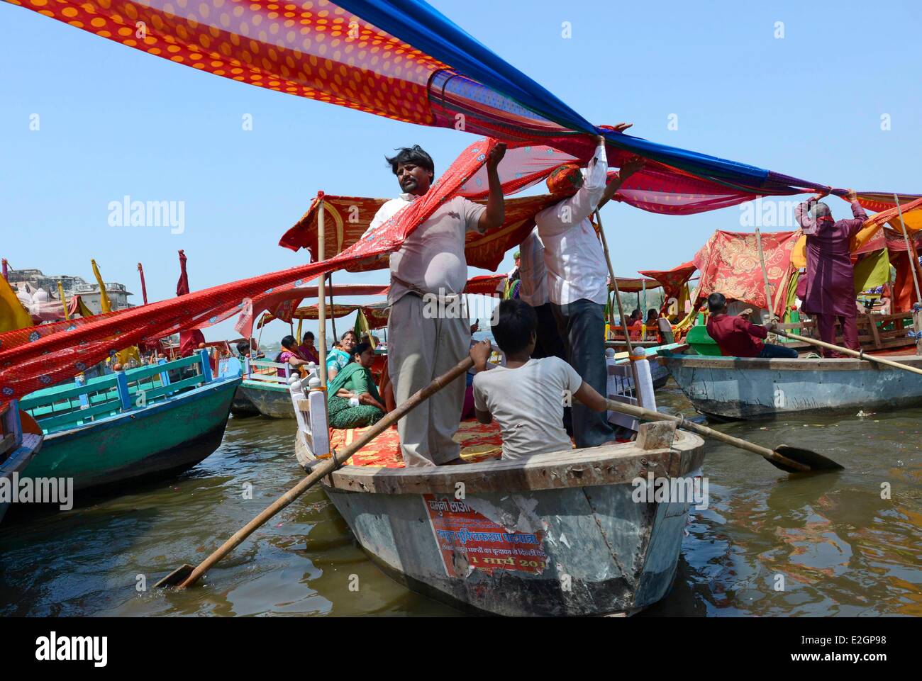 India Uttar Pradesh State Mathura people tie saris together across river during Holi festival celebrations Stock Photo