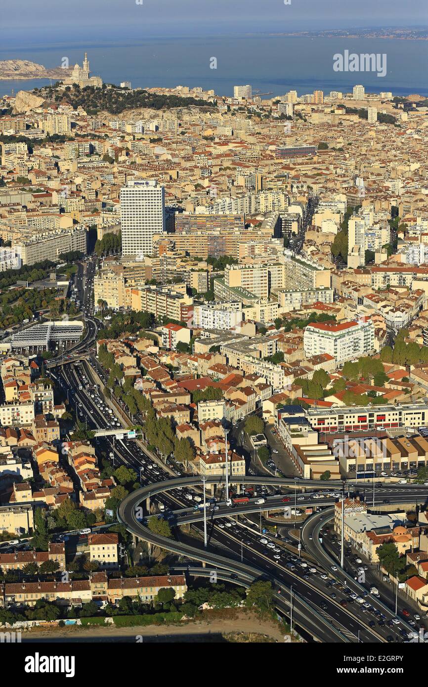 France Bouches du Rhone Marseille European capital of culture 2013 district Capelette A50 motorway Notre Dame de la Garde in background (aerial view) Stock Photo