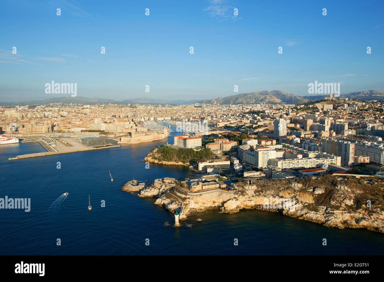 France Bouches du Rhone Marseille European capital of culture 2013 Pharo Pharo Palace and Vieux Port and Basilique Notre Dame de la Garde in background (aerial view) Stock Photo