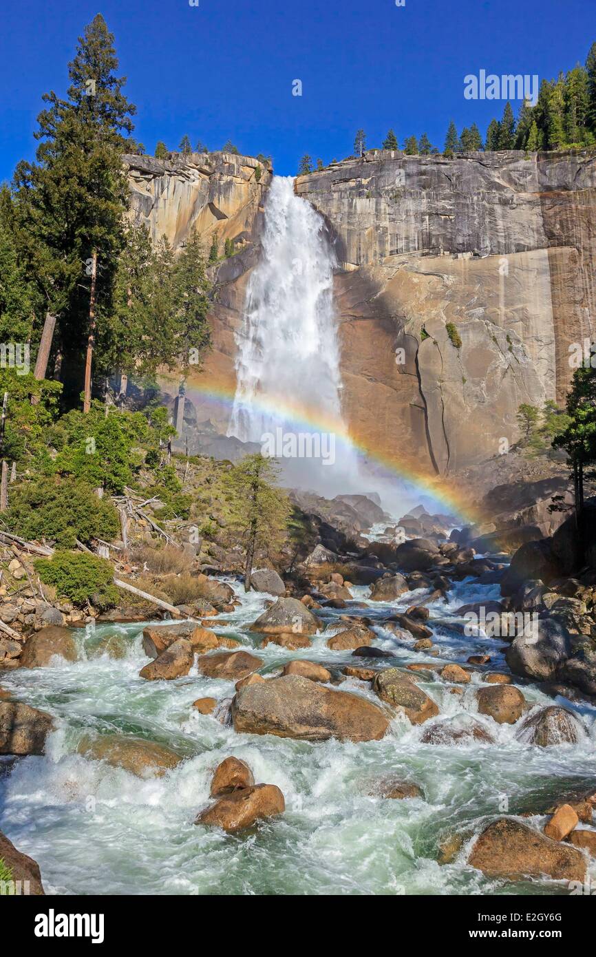 United States California Sierra Nevada Yosemite National Park listed as World Heritage by UNESCO Yosemite Valley Nevada Fall with rainbow over Merced River Stock Photo