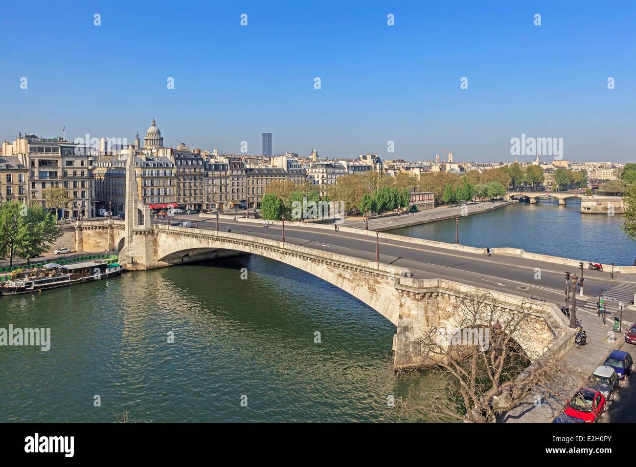 France Paris banks of Seine river listed as World Heritage by UNESCO river Seine with Pont de Tournelle between Ile Saint Louis and left bank La Tour d'Argent restaurant on left and Pantheon in background Stock Photo