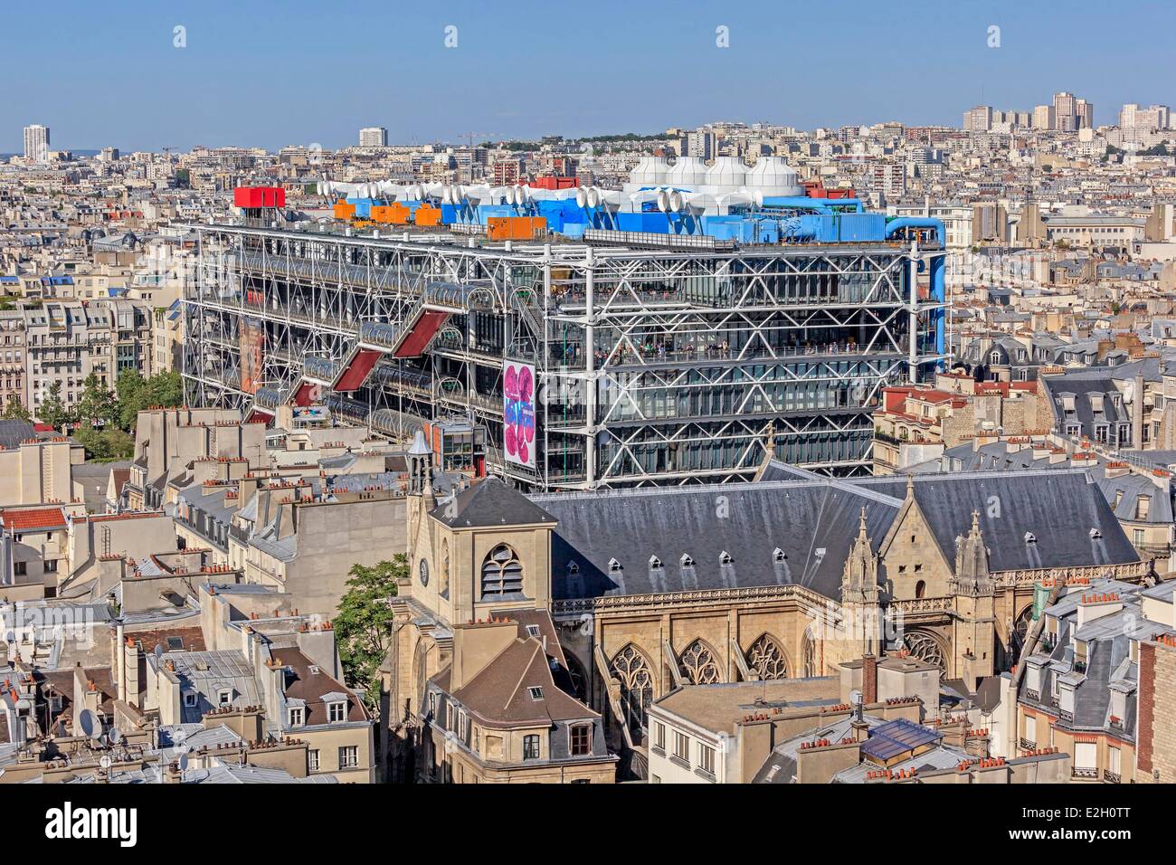 France Paris Pompidou Center by architects Renzo Piano Richard Rogers and Gianfranco Franchini and Saint Merri church Stock Photo