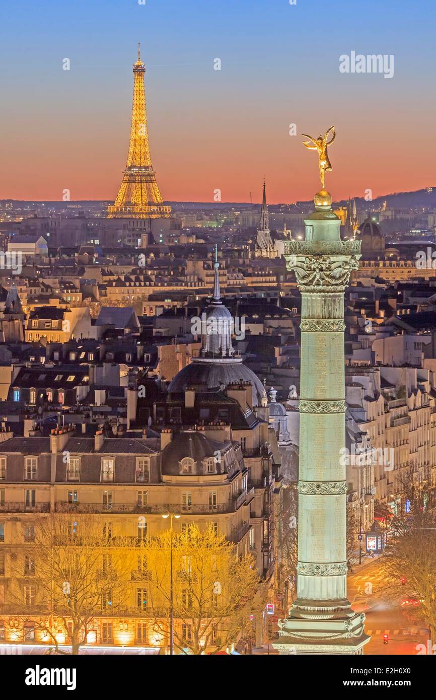 France Paris July Column (Colonne de Juillet) at Place de la Bastille and Eiffel Tower (⌐ SETE illuminations Pierre Bideau) illuminated at night Stock Photo