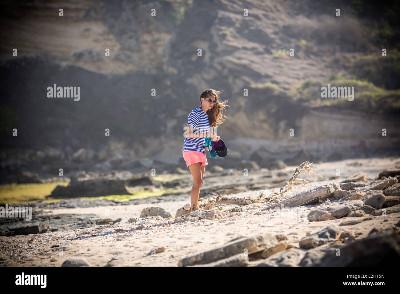 Woman walks alone on beach hi-res stock photography and images - Alamy