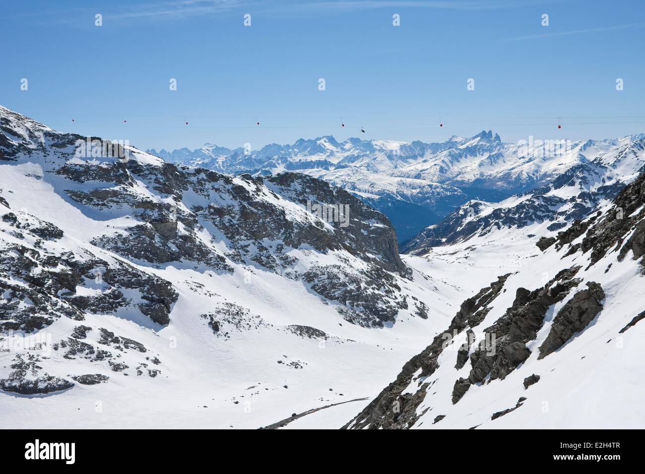 France Savoie Orelle Val Thorens Three Valleys ski area world's highest zipline (1300m long and 250m high) departure is at 3250m altitude in background massif and Barre des Ecrins Stock Photo