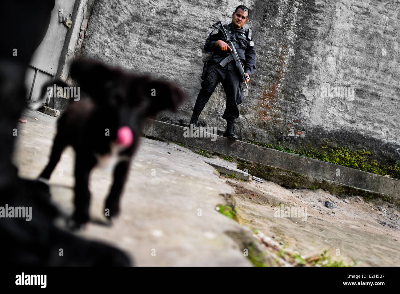 A policeman from the special emergency unit (Halcones) patrols in a gang neighbourhood of San Salvador, El Salvador. Stock Photo
