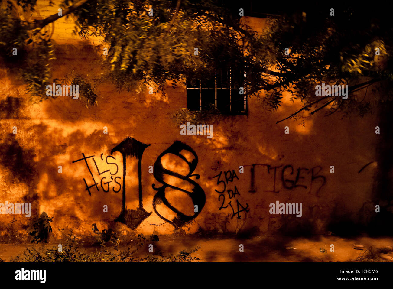 A Barrio 18 gang graffiti, a symbol marking the gang's territory, is seen in Soyapango, San Salvador, El Salvador. Stock Photo